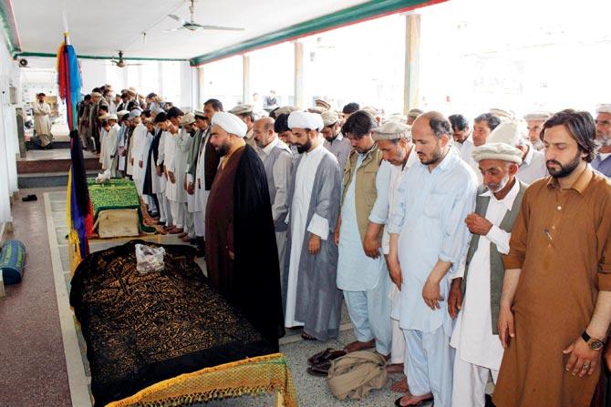 Pakistani mourners offer funeral prayers for the victims of a roadside bomb blast in Parachinar. Pic/AFP