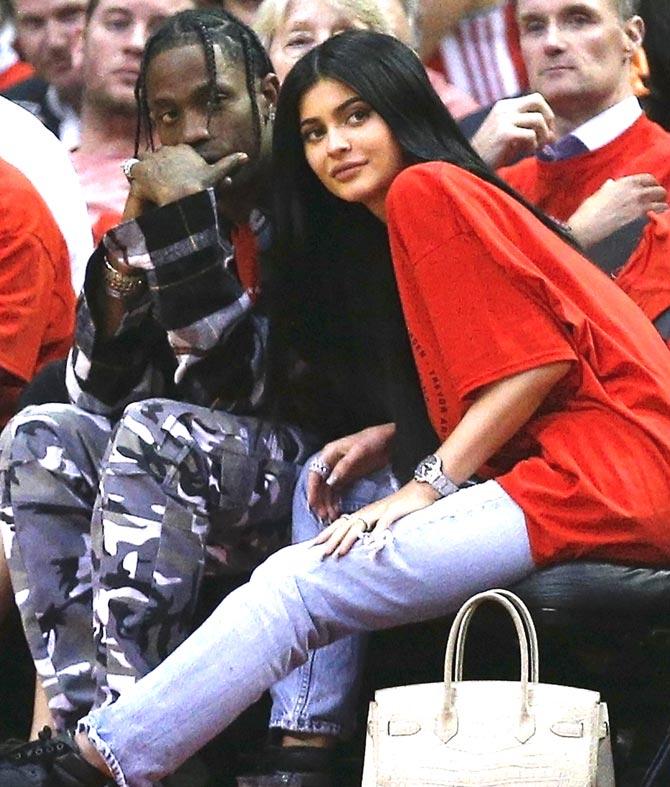 Rapper Travis Scott and Kylie Jenner watch courtside during Game Five of the Western Conference Quarterfinals game of the 2017 NBA Playoffs at Toyota Center. Pic/AFP
