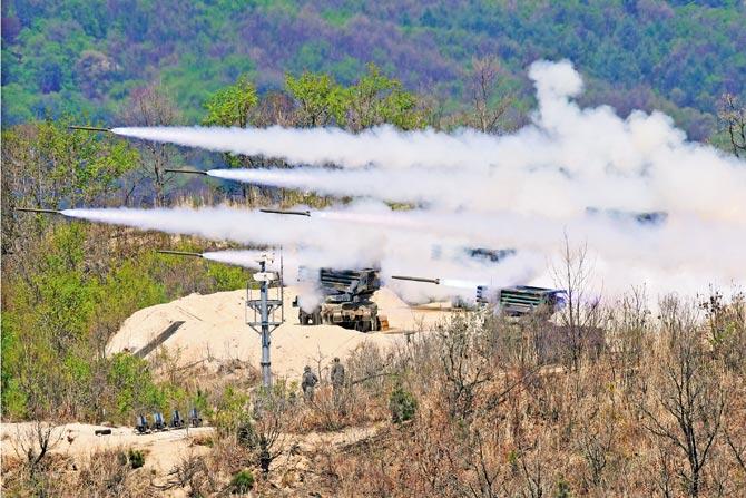 South Korean K-136 Kooryong 130mm 36-round multiple rocket launch system fire rockets during a joint live drill with the US at the Seungjin Fire Training Field in Pocheon on Wednesday. Pic/AFP
