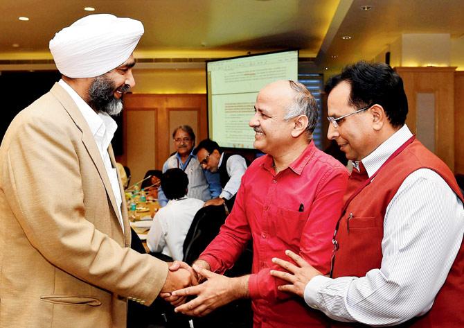 Delhi Deputy Chief Minister Manish Sisodia and Punjab Finance Minister Manpreet Singh Badal during the 13th GST Council Meeting at Vigyan Bhawan in New Delhi on Friday. Pic/PTI