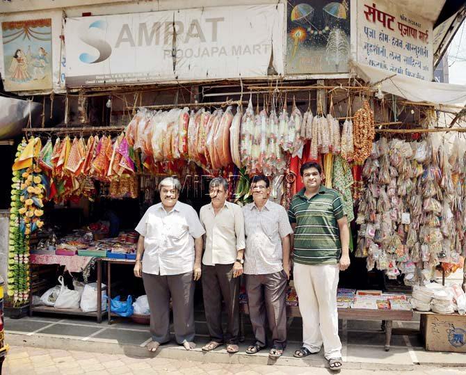 The proprietors of Sampat Poojapa Mart outside their 125-year-old shop; brothers Rajesh, Mukesh and Virendra Sampat with Virendra