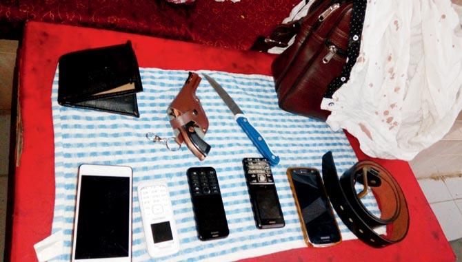 Five mobile phones, a knife, gun lighter and blood-stained shirt were recovered 