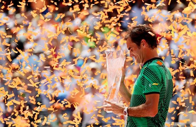  Roger Federer of Switzerland holds the winner