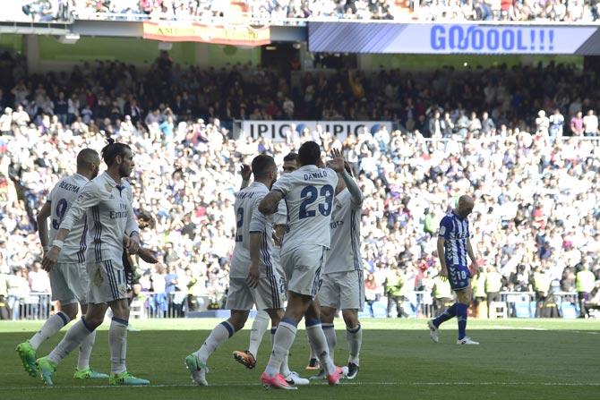 Real Madrid players celebrate a goal during the Spanish league football match Real Madrid CF vs Deportivo Alaves. Pics/AFP