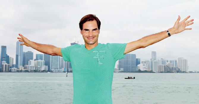  Roger Federer poses in front of the Miami skyline after his win over Rafael Nadal  at the Miami Open in Florida on Sunday. Pic/AFP