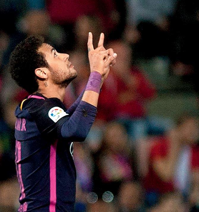 Barcelona’s Neymar celebrates after scoring against Granada FC on Sunday. Pic/AFP
