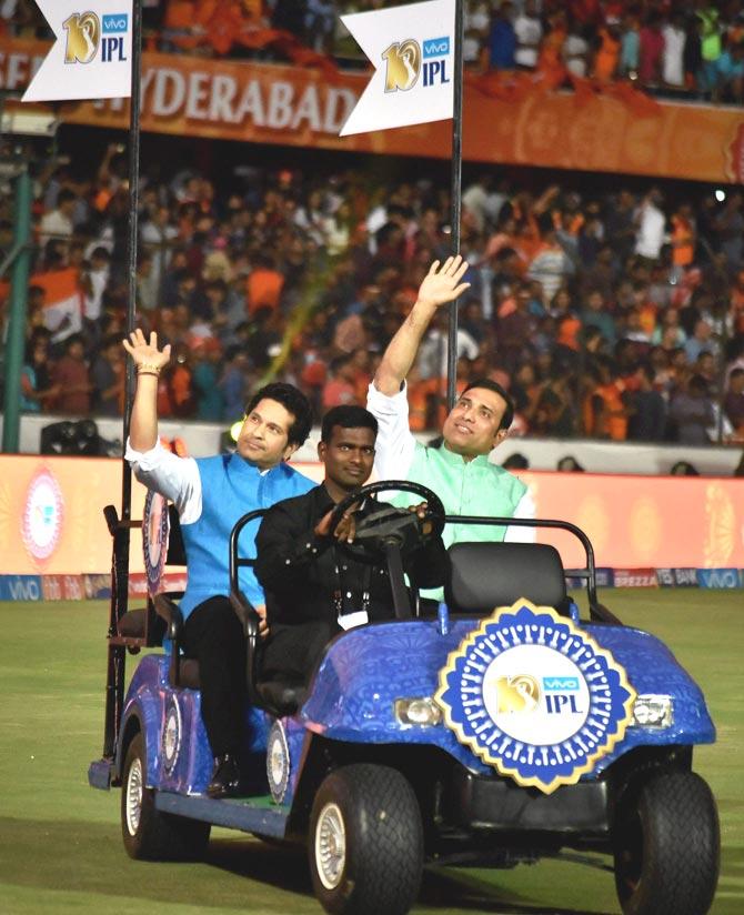 Indian cricket legends Sachin Tendulkar and VVS Laxman wave at spectators from a battery-operated car during the opening ceremony of 10th edition of the Indian Premier League. Pics/PTI