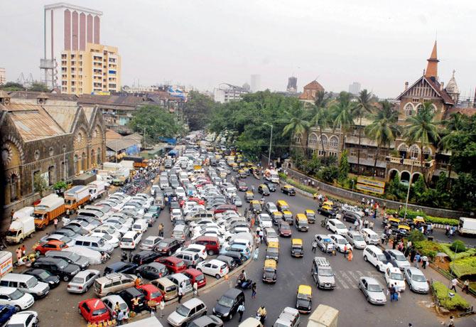 A parking lot choked with vehicles opposite the police commissioner’s office