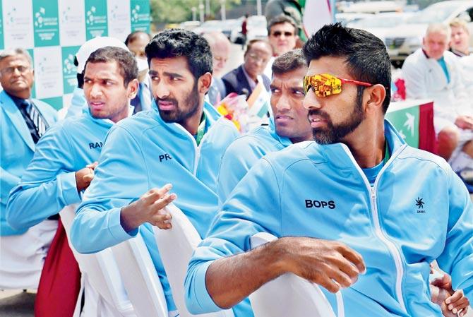 India’s Davis Cup players Ramkumar Ramnathan (extreme left), Prajnesh Gunneswaran, Sriram Balaji and Rohan Bopanna look towards the board during the draw ceremony in Bangalore yesterday. Pic/PTI