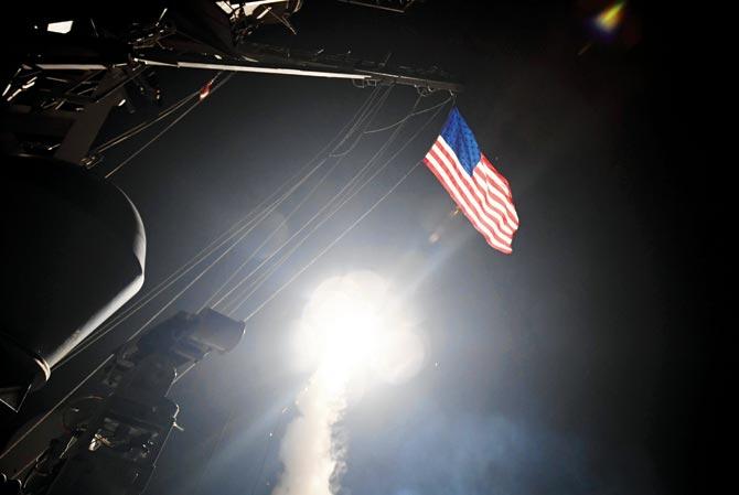 In images released by the US Navy, the guided-missile destroyer USS Porter conducts strike operations. Pic/AFP