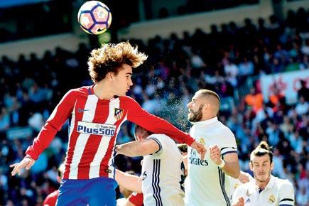 Antoine Griezmann's late strike helps Atletico hold Real Madrid 1-1