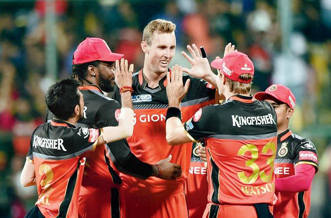 RCB’s Billy Stanlake and mates celebrate the wicket of DD’s Karun Nair in Bangalore on Saturday. Pic/PTI