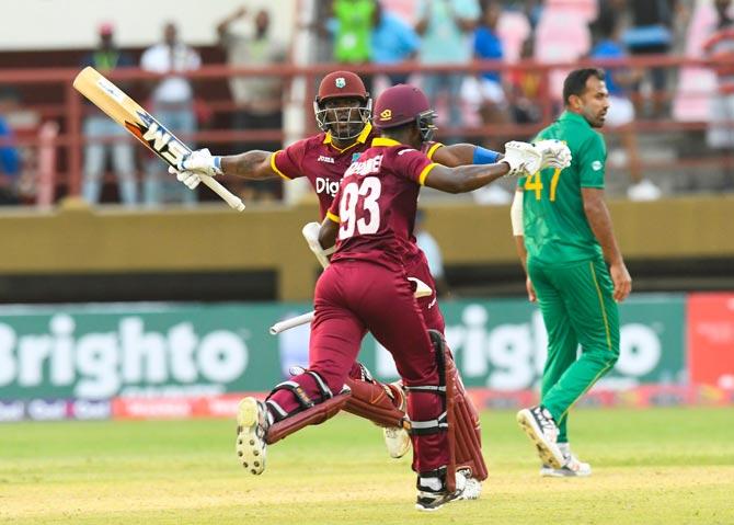 Ashley Nurse (L) and Jason Mohammed (C) of West Indies celebrate winning the 1st ODI match between West Indies and Pakistan. Pic/AFP