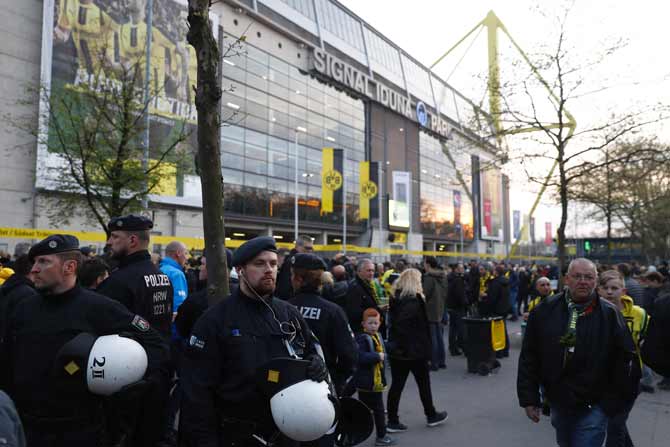 Police patrol outide the stadium after the team bus of Borussia Dortmund had some windows broken by an explosion some 10km away from the stadium prior tothe UEFA Champions League 1st leg quarter-final football match BVB Borussia Dortmund v Monaco in Dortmund, western Germany on April 11, 2017. 