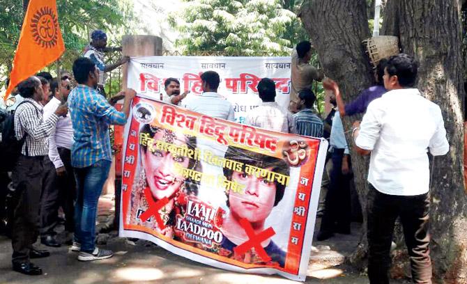 Activists outside film producer TP Aggarwal