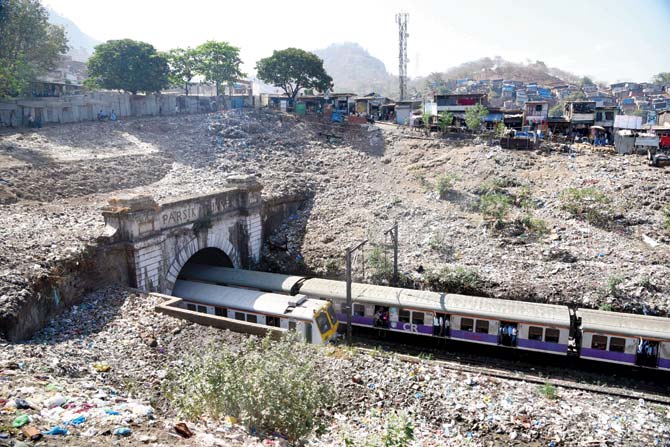 The slums above Parsik tunnel in Thane have affected the foundation of the structure. File pic