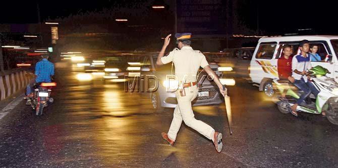 The cops spared no one, even chasing the bikers on foot when they had to. Pics/Sameer Markande