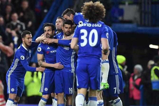 Diego Costa is congratulated by Chelsea teammates after his goal