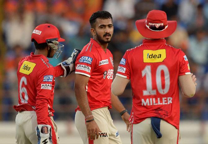 Kings XI Punjab cricketer KC Cariappa (C) celebrates with teammates after taking the wicket of Gujarat Lions cricketer Akshdeep Nath during the 2017 Indian Premier League (IPL) Twenty20 cricket match between Gujarat Lions and Kings XI Punjab at The Saurashtra Cricket Association Stadium in Rajkot on Sunday. Pic/AFP
