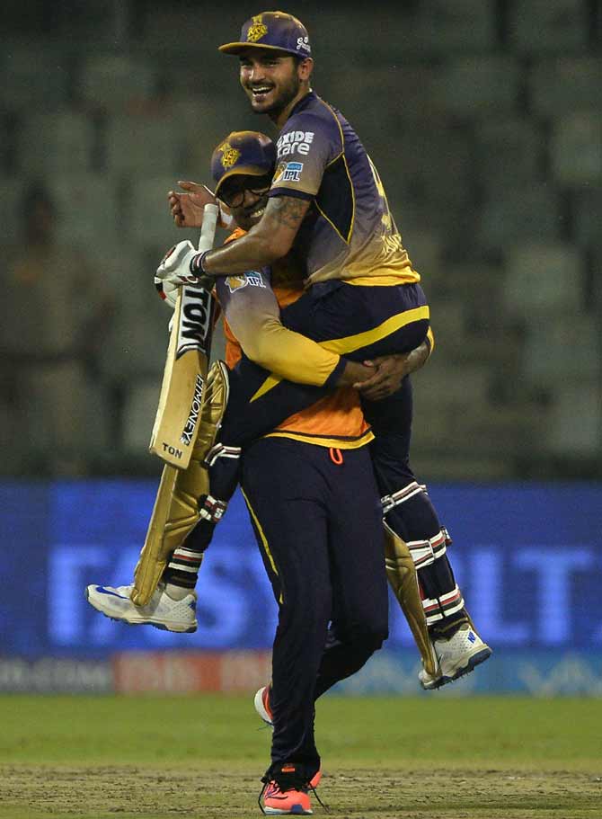 Kolkata Knight Riders cricketer Manish Pandey (R) is picked up by teammate Darren Bravo as he celebrates after victory in the 2017 Indian Premier League (IPL) Twenty20 cricket match between Delhi Daredevils and Kolkata Knight Riders at the Feroz Shah Kotla cricket stadium in New Delhi on Monday. Pic/AFP