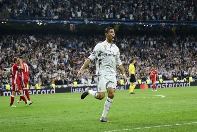 Cristiano Ronaldo celebrates during the UEFA Champions League quarter-final 