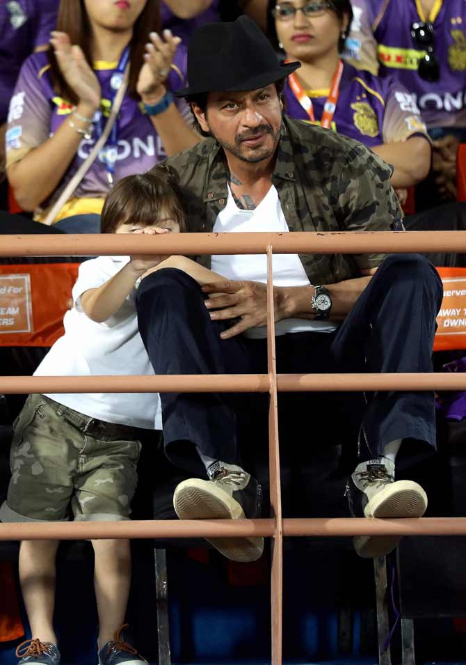 Shah Rukh Khan co-owner of Kolkata Knight Riders with his son AbRam during match 3 of the Vivo 2017 Indian Premier League between the Gujarat Lions and the Kolkata Knight Riders at the Saurashtra Cricket Association Stadium in Rajkot on Friday. PTI