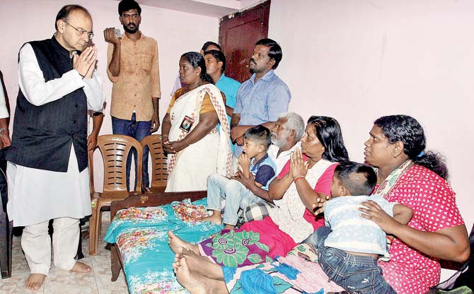 Union Finance Minister Arun Jaitley visits the family members of slain RSS worker Rajesh Edavakode. Pic/PTI