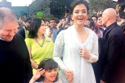 Aishwarya Rai Bachchan and daughter Aaradhya twin in white