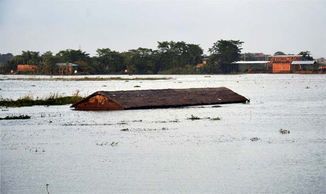 An inundated village at Suprakandhi in flood-hit Karimganj district of Assam. Pic/PTI