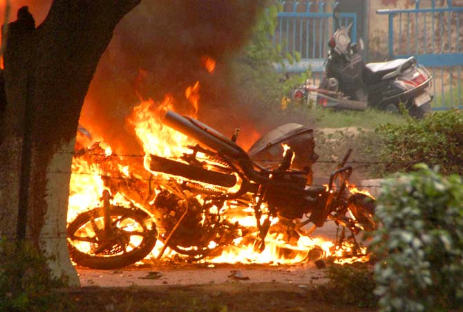 A bike burn in violence following Dera Sacha Sauda chief Gurmeet Ram Rahim’s conviction in Panchkula. Pic/AFP