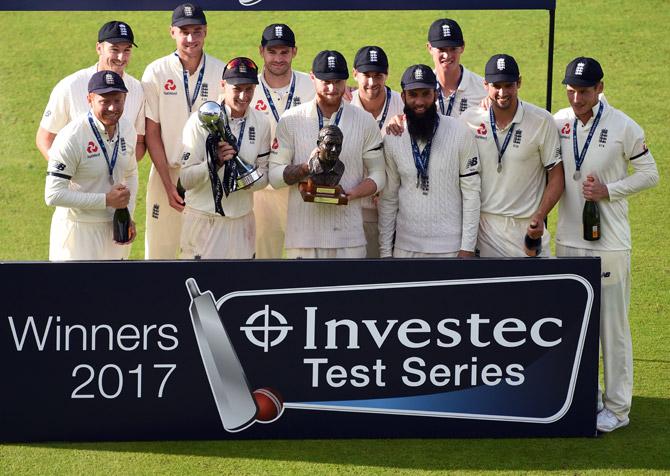 England players celebrate winning the fourth Test match, and Test series, against South Africa, on day 4 of the fourth Test match at Old Trafford cricket ground in Manchester on August 7, 2017. Moeen Ali completed a brilliant series with a five-wicket haul as England beat South Africa by 177 runs in the fourth Test at Old Trafford on Monday. Victory, achieved with more than a day to spare, also saw England take the four-match series 3-1, with Joe Root triumphant in his first series as England captain. Pic/AFP