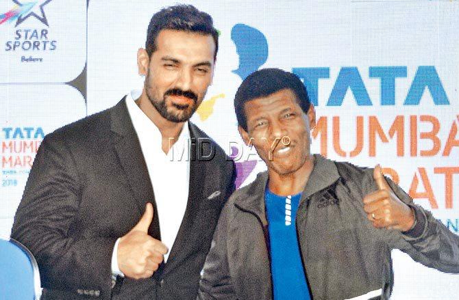 Ex-Ethiopian great Gebrselassie (right) with actor John Abraham during a Mumbai Marathon event on Tuesday. Pic/Bipin Kokate
