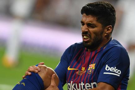 Striker Luis Suarez's injury adds to Barcelona's woe