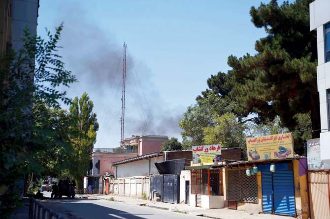 Smoke rises from the direction of the attack on the Iraqi embassy