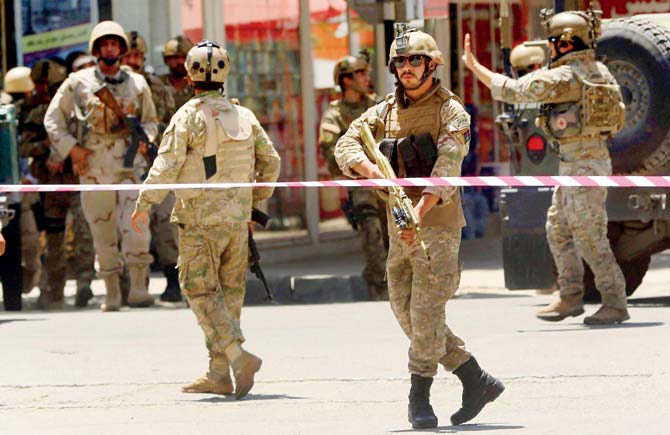Security forces respond at the site of the attack. All the attackers had been killed roughly four hours after the assault began. Pics/AFP