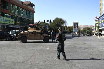 At least 20 killed as bomber and gunmen attack mosque in Kabul