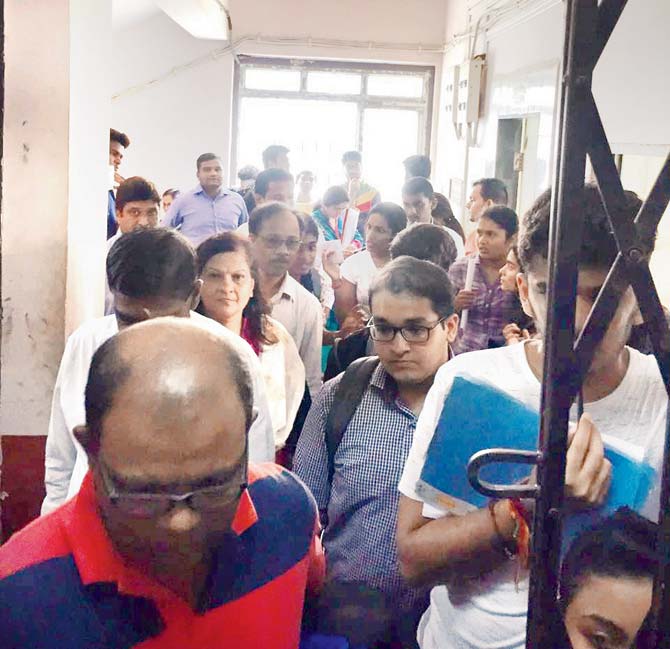 Students gather at Examination House at the Kalina campus to protest