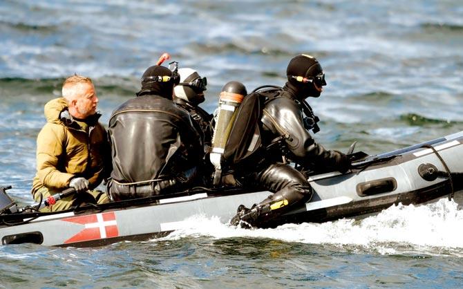 Divers from the Danish Defence Command prepare for a dive in Koge Bugt, Copenhagen, where Kim Wall