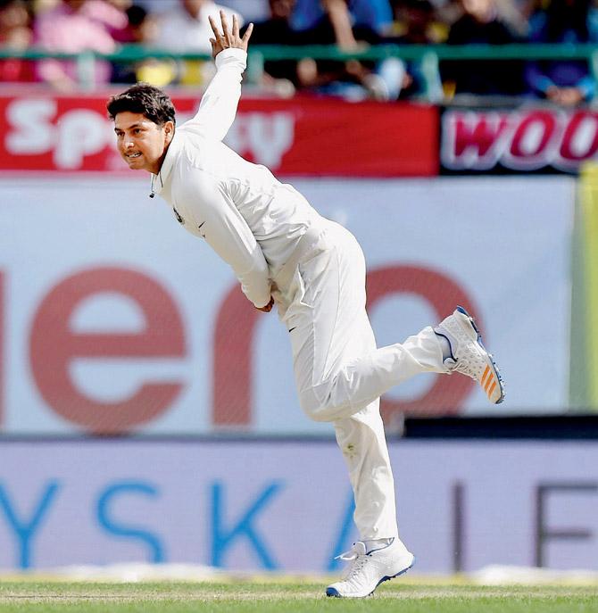 Kuldeep Yadav bowls during his debut Test against Australia at the HPCA Stadium in Dharamsala early in the year. Pic/PTI