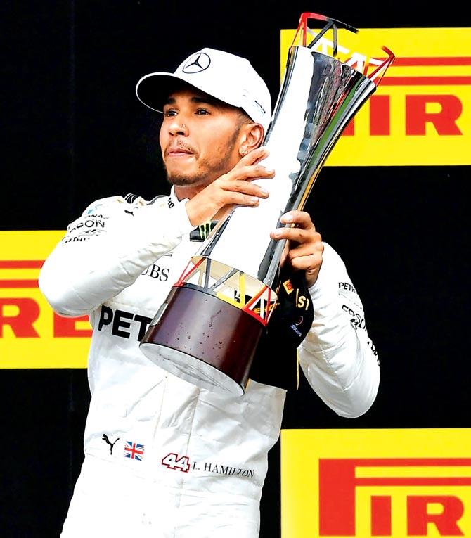 Mercedes driver Lewis Hamilton celebrates after winning the Belgian GP yesterday. Pic/AFP