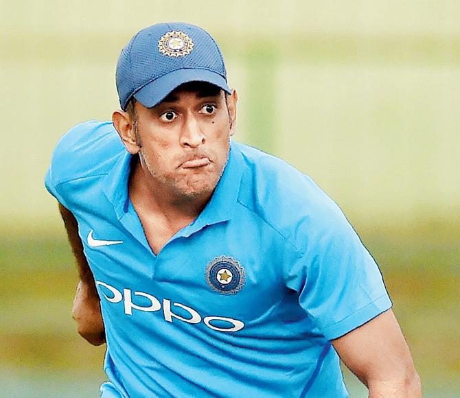 An expressive Mahendra Singh Dhoni during a game of football at the Pallekele International Cricket Stadium yesterday.Pic/AFP