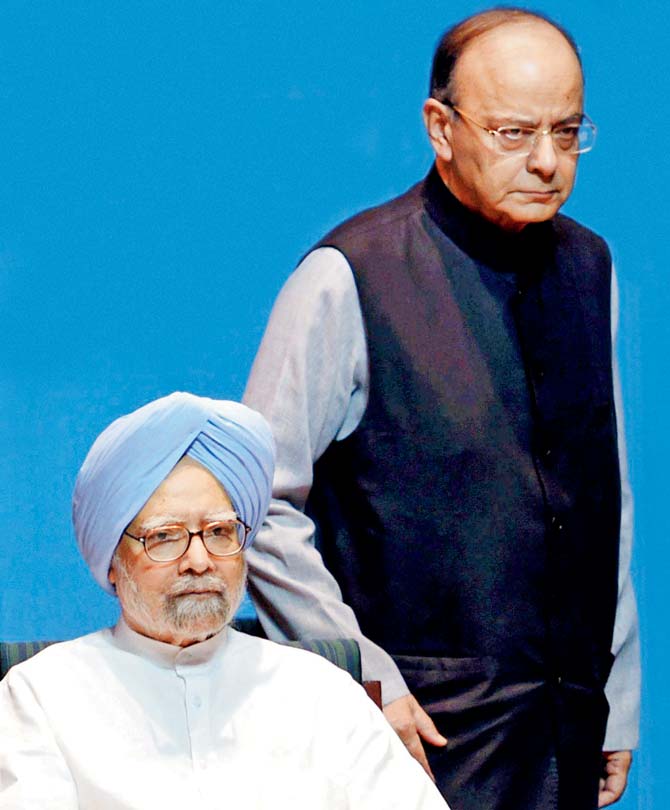 Former Prime Minister Manmohan Singh and Finance Minister Arun Jaitley at a book launch in the Capital. Pics/PTI