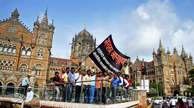 Activists of Maratha Kranti Morcha, which will carry out a silent protest tomorrow, outside the Chhatrapati Shivaji Maharaj Terminus, in Mumbai on Tuesday. Pic/AFP