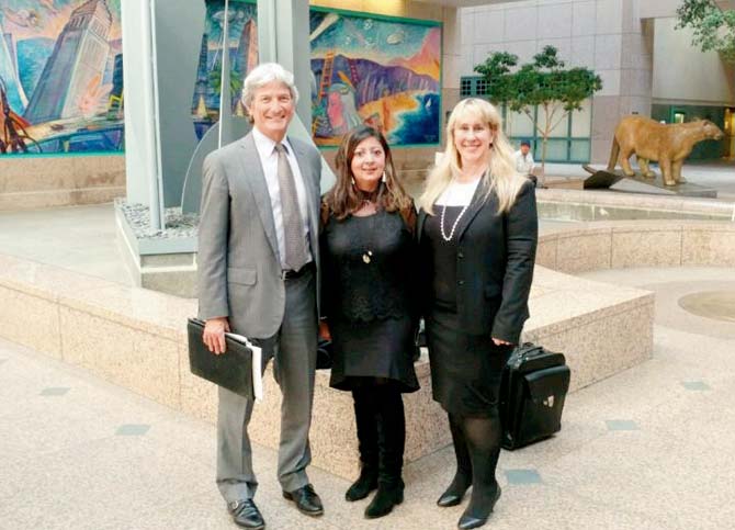 Survivor Minakshi Jafa-Bodden (centre) with her lawyers Mark Quigley (left) and Carla Minnard in the Court of Appeal on August 16