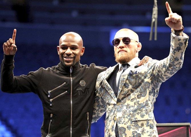 Floyd Mayweather Jr. and Conor McGregor. Pic/AFP