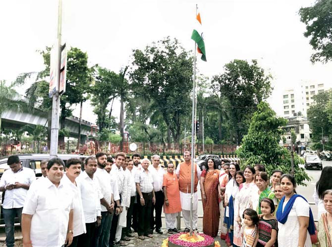 BJP workers for flag-hoisting, which was done by BJP corporator Nehal Shah on Tuesday