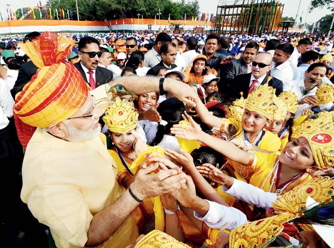 PM Narendra Modi interacts with children after addressing the nation from the ramparts of Red Fort in New Delhi on the occasion of the 71st Independence Day yesterday