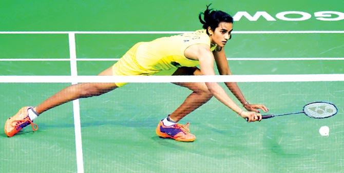 PV Sindhu stretches to make a return during the final yesterday. Pics/AFP