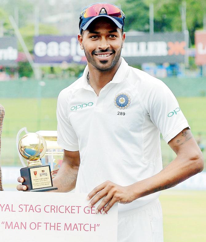 Hardik Pandya holds the Man of the Match trophy. Pic/AFP