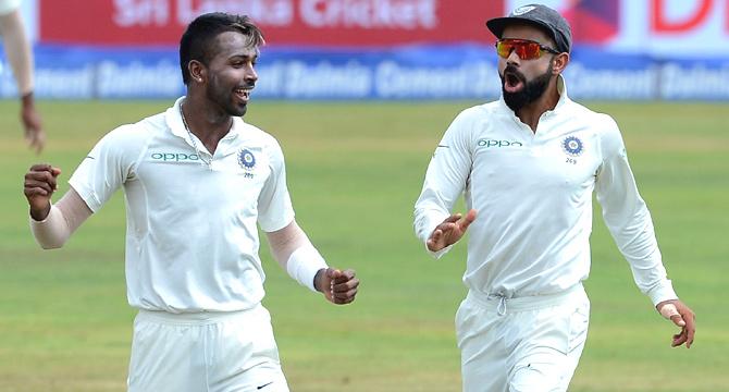Indian cricketer Hardik Pandya (C) celebrates with his captain Virat Kohli after he dismissed Sri Lankan cricketer Angelo Mathews during the second day of the third and final Test match between Sri Lanka and India at the Pallekele International Cricket Stadium in Pallekele on August 13, 2017. Pic/AFP 